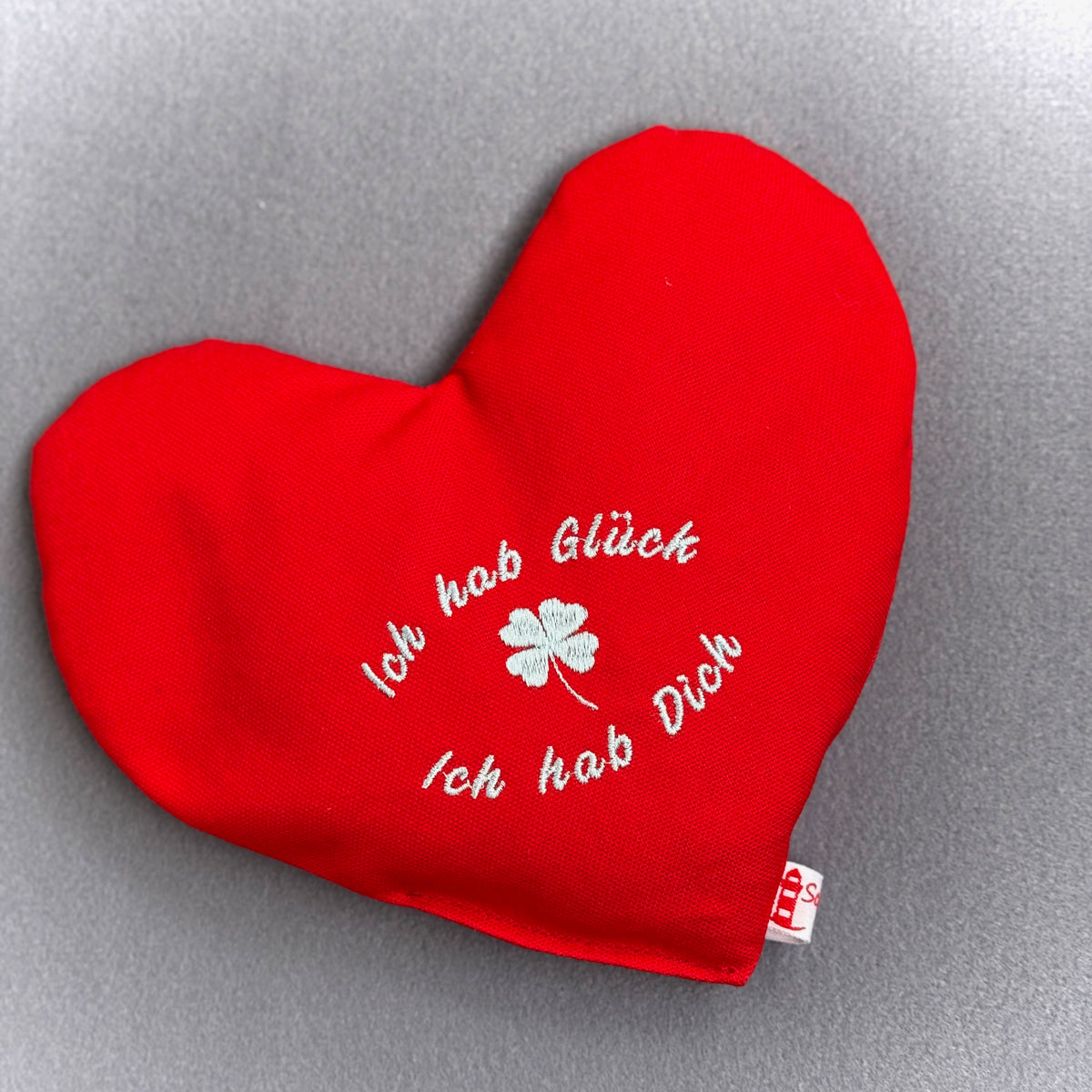 "Herzenswärmer" bestickt - "Ich hab Glück..." Rot