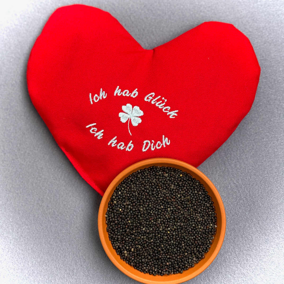"Herzenswärmer" bestickt -  "Ich hab Glück..." Rot